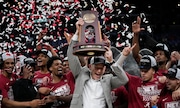 Alabama head coach Nate Oats holds the winner's trophy after a win over Clemson in an Elite 8 college basketball game in the NCAA tournament Saturday, March 30, 2024, in Los Angeles.